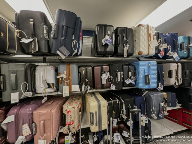 a shelf with luggage on it