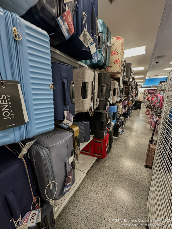 a group of luggage on shelves