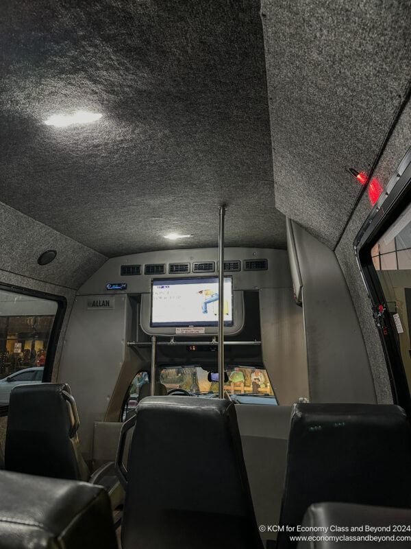 inside a bus with a screen on the front