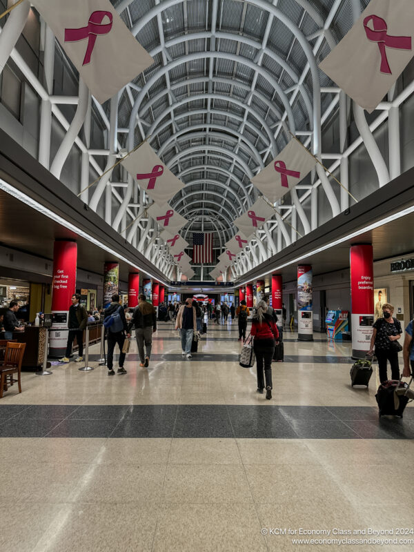 a group of people in a large airport