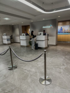 people standing at a reception desk