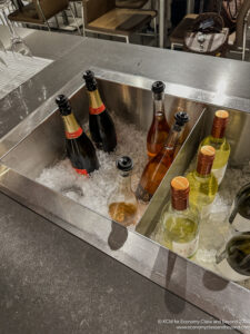 a group of bottles in a metal sink