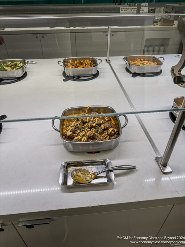 a group of pans of food on a counter