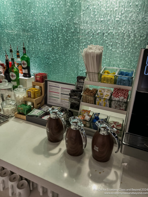 a counter with a few coffee containers and other items