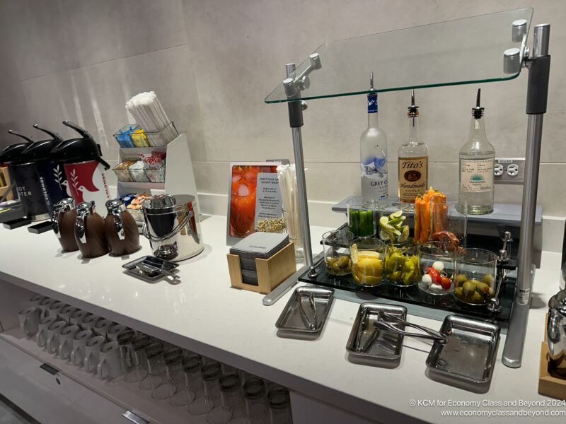 a bar with various drinks and utensils