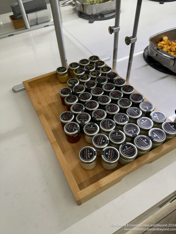 a group of jars on a wooden tray