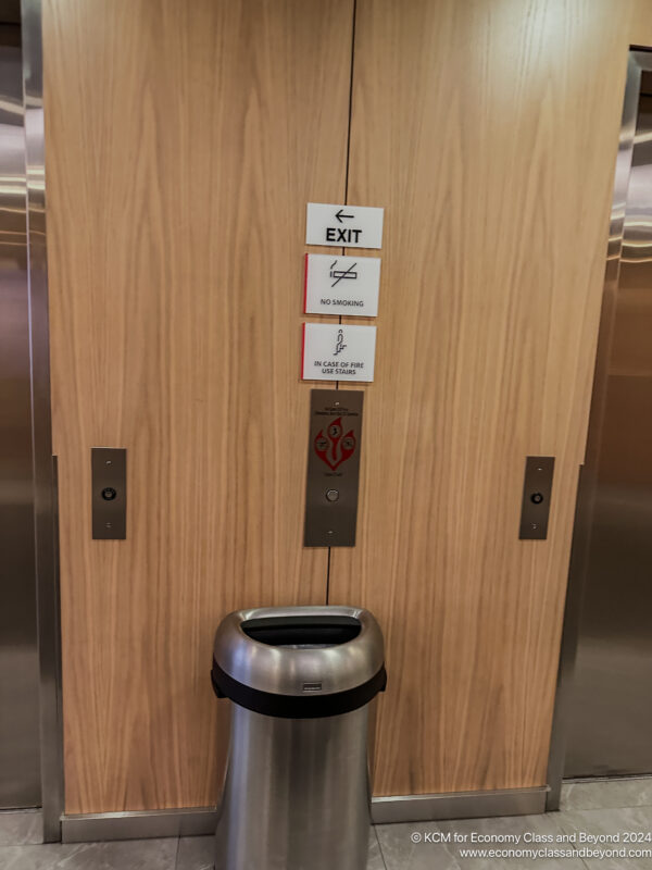 a trash can in an elevator