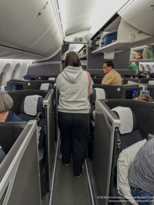 a woman walking on an airplane