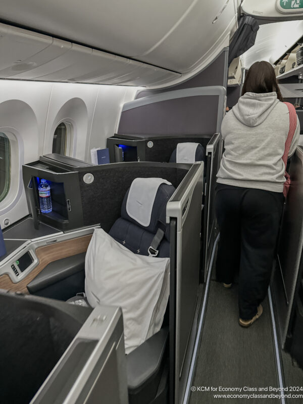 a woman walking on an airplane