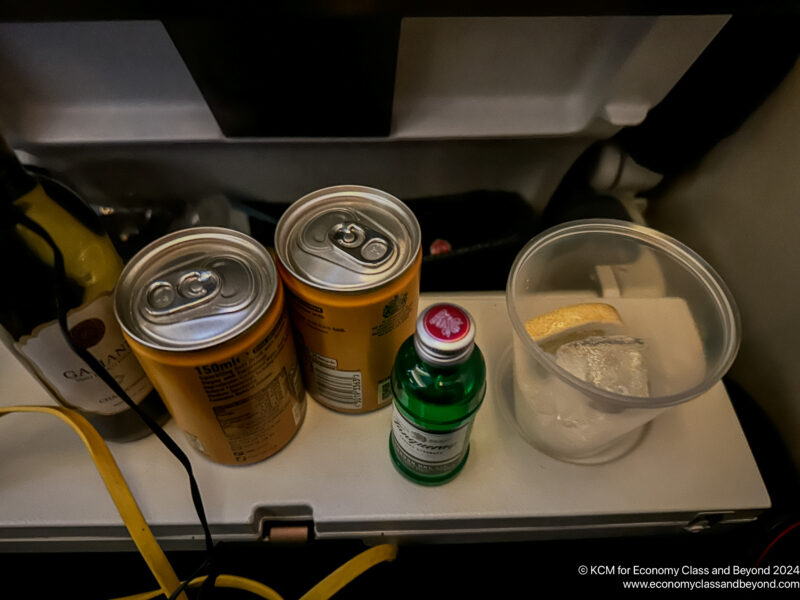 a group of cans and a cup on a table