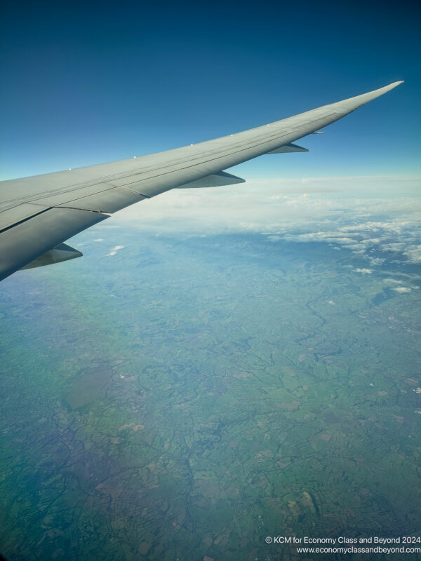 an airplane wing in the sky