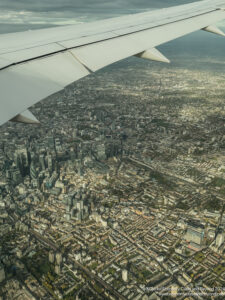 an airplane wing and city