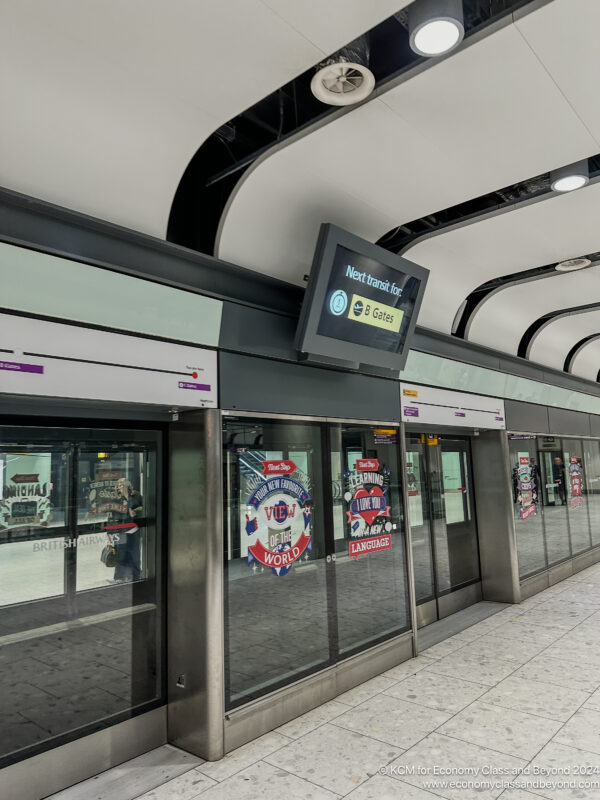 a subway station with doors and signs