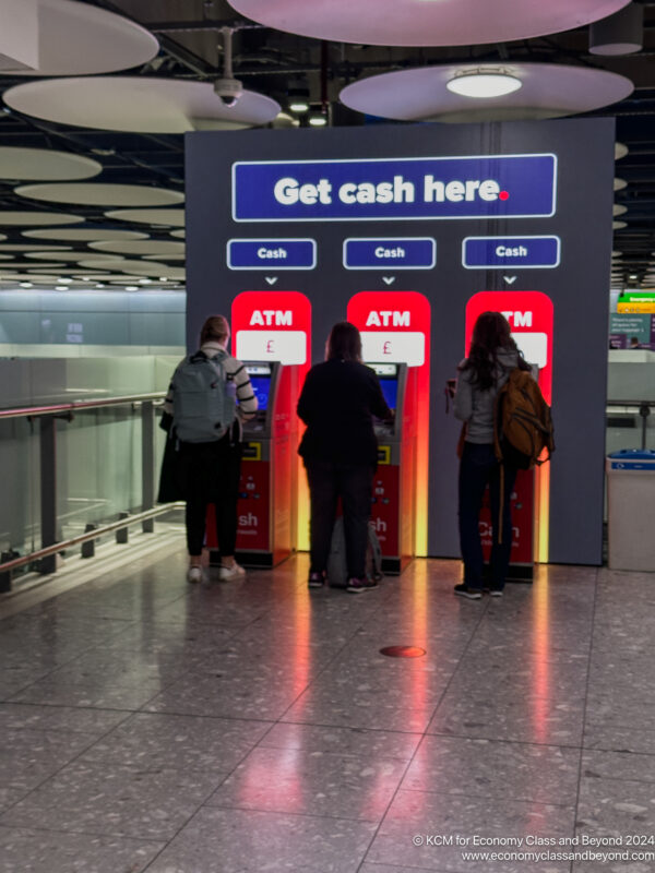 people standing in front of a machine