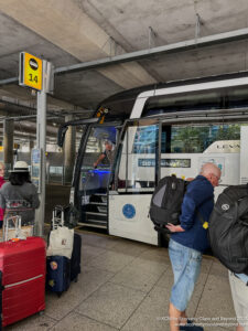 a group of people boarding a train