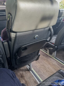 a seat with a black object on it