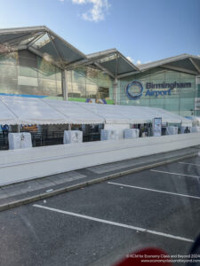 a white tents in front of a building