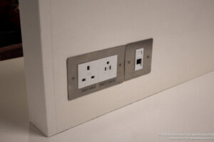 a wall outlet with a couple of plugs