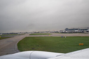 an airport with airplanes on the runway