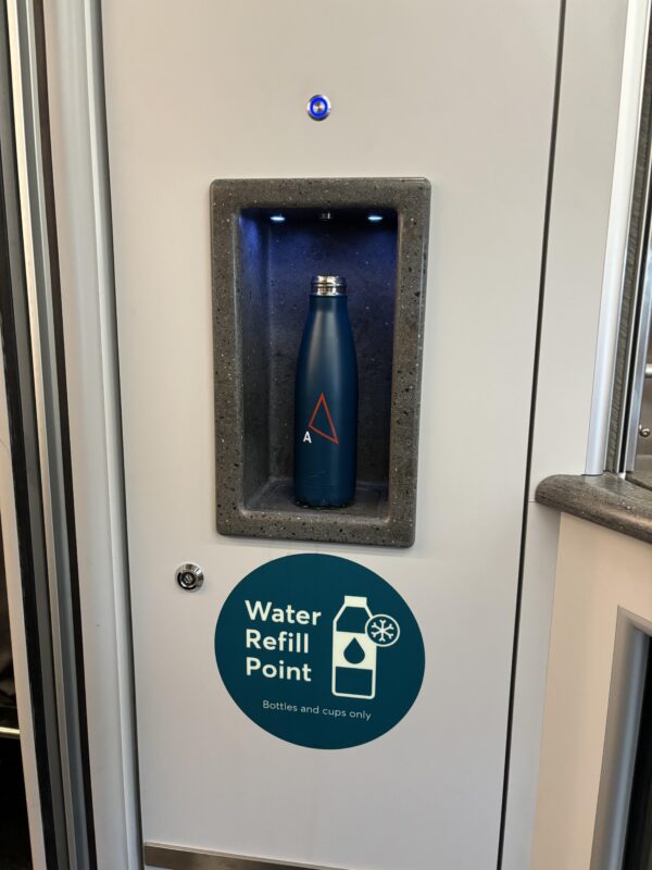 a water refill point in a grey box