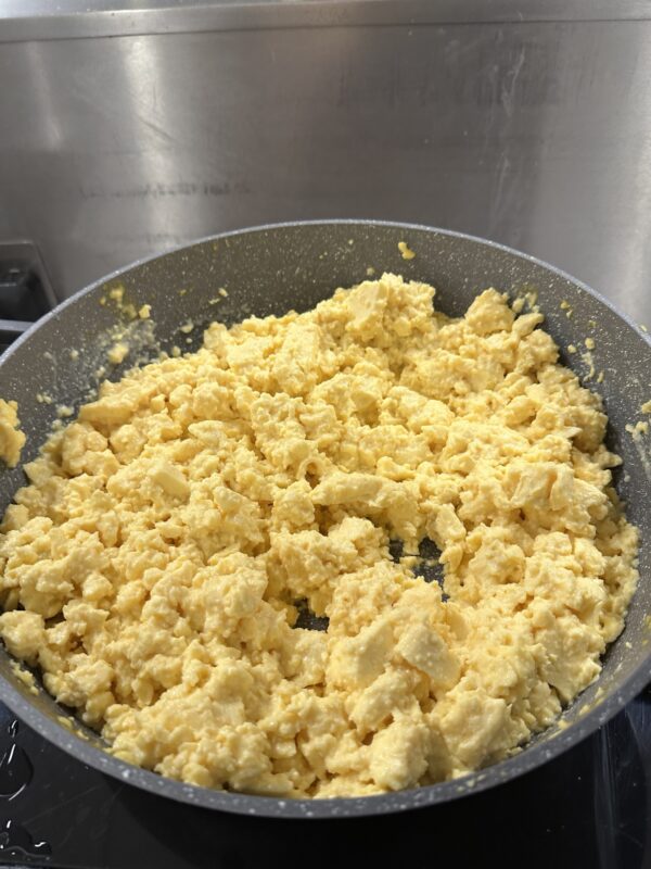 a pan of scrambled eggs