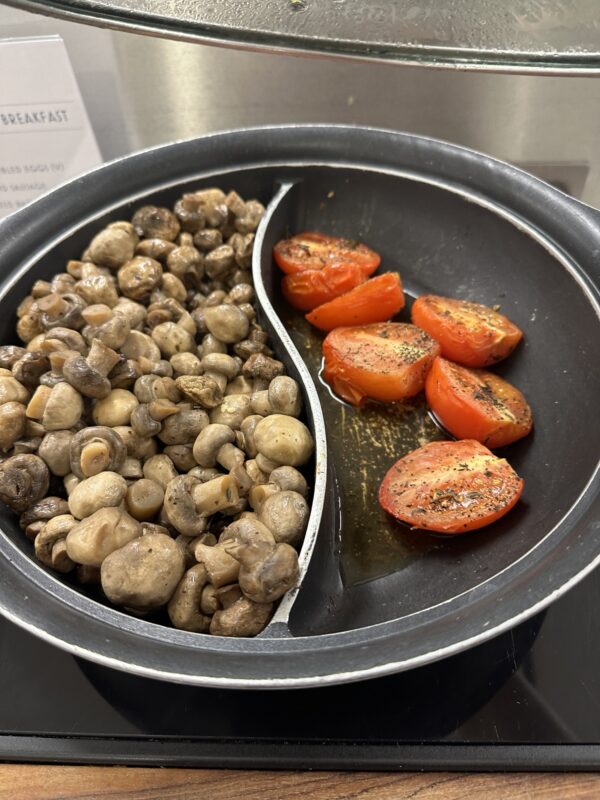 a plate of mushrooms and tomatoes