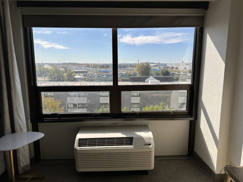 a room with a window and a heater