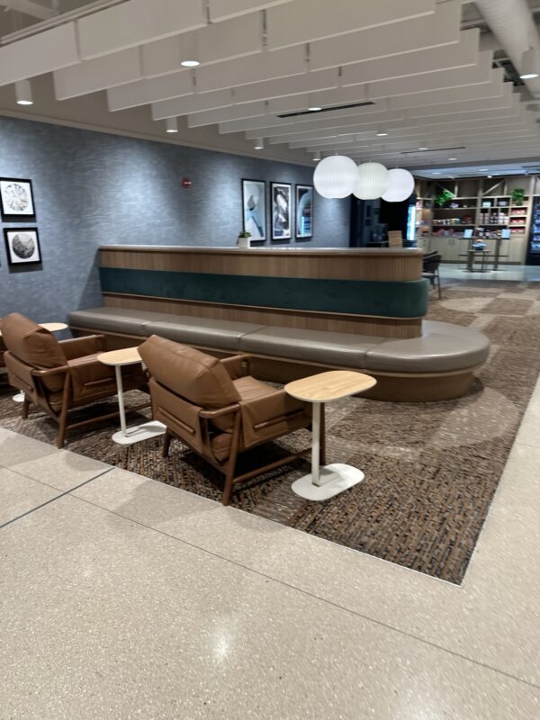 a reception area with chairs and a table