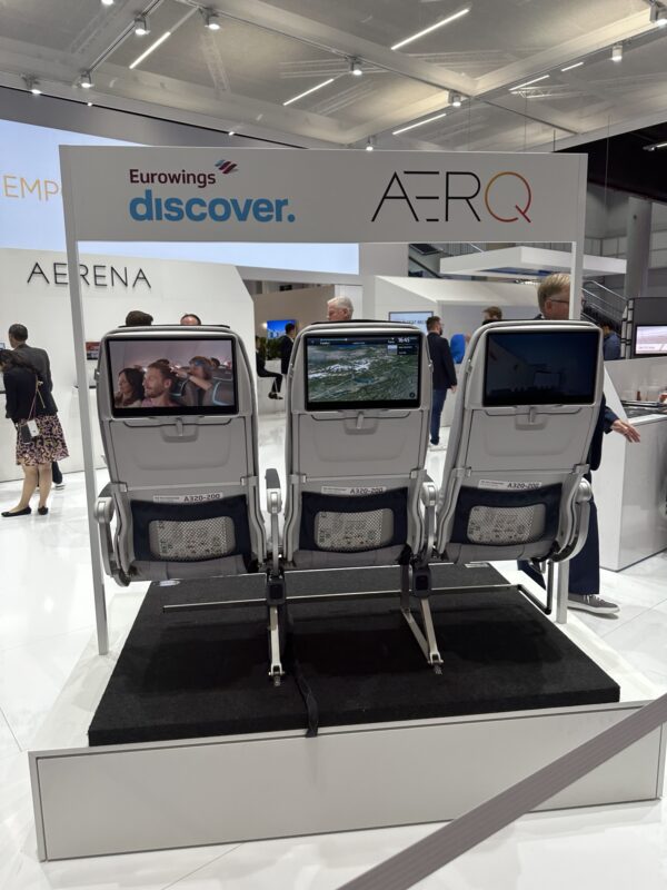 a group of seats with screens on them