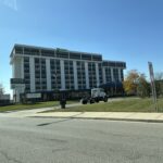 a large building with a truck parked outside