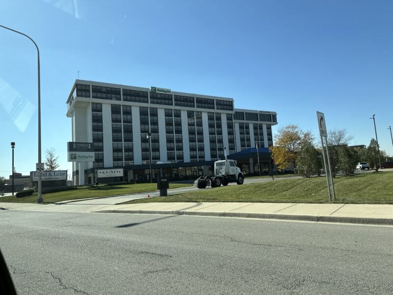 a large building with a truck parked outside