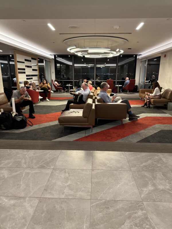 a group of people sitting in a lounge area