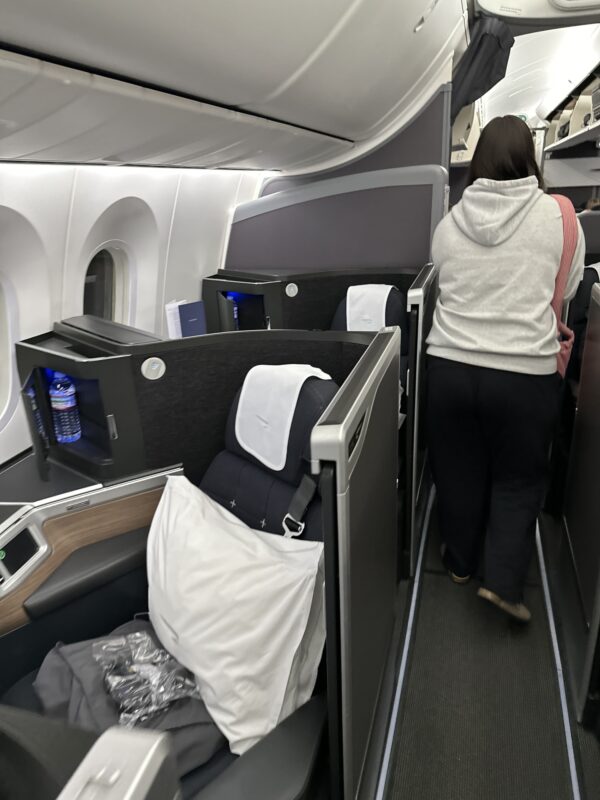 a woman walking on an airplane