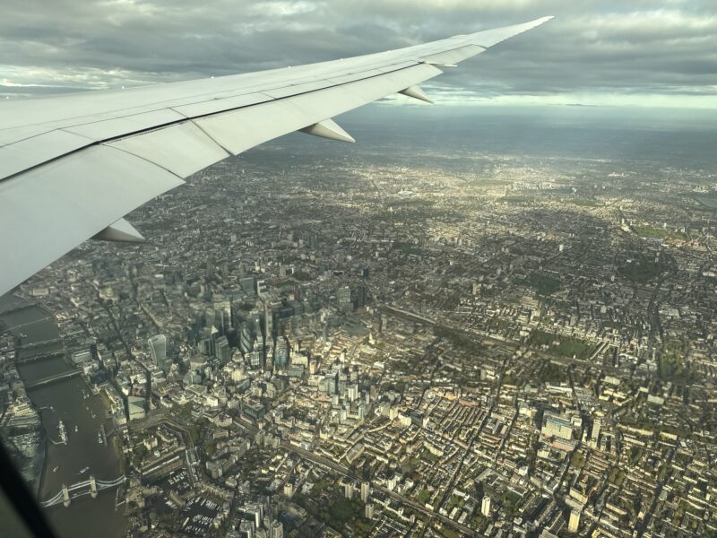 an airplane wing and city view