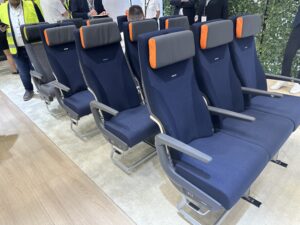 a row of blue and orange seats