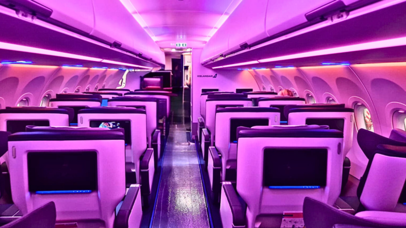 an airplane with purple lights