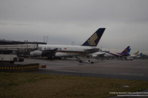 a group of airplanes at an airport