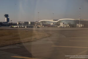 an airport with a plane in the background