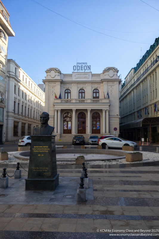 a statue of a man in front of a building