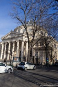 a white building with columns and a domed roof