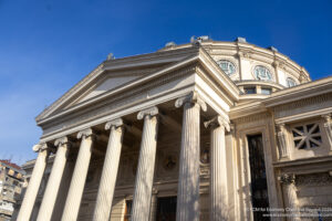 a building with columns on the roof