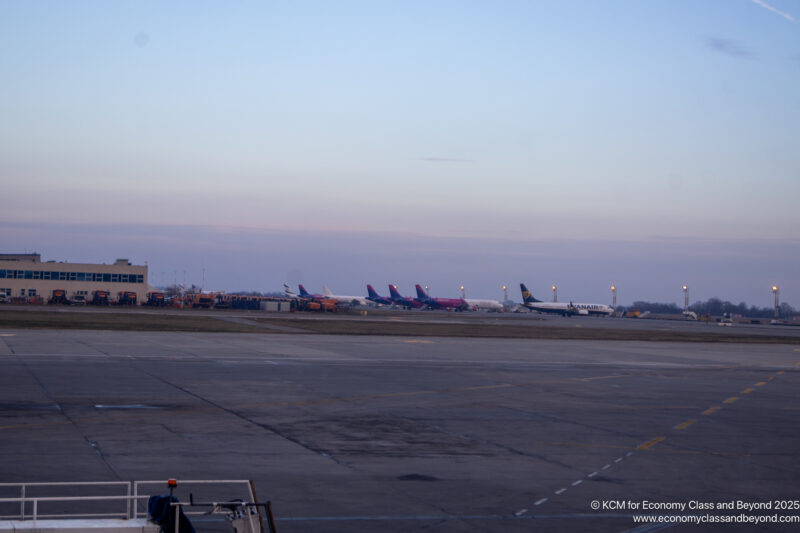 a group of airplanes on a runway