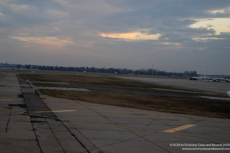 a runway with a plane on it