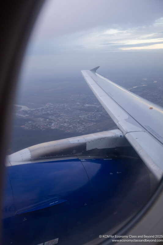 an airplane wing in the sky