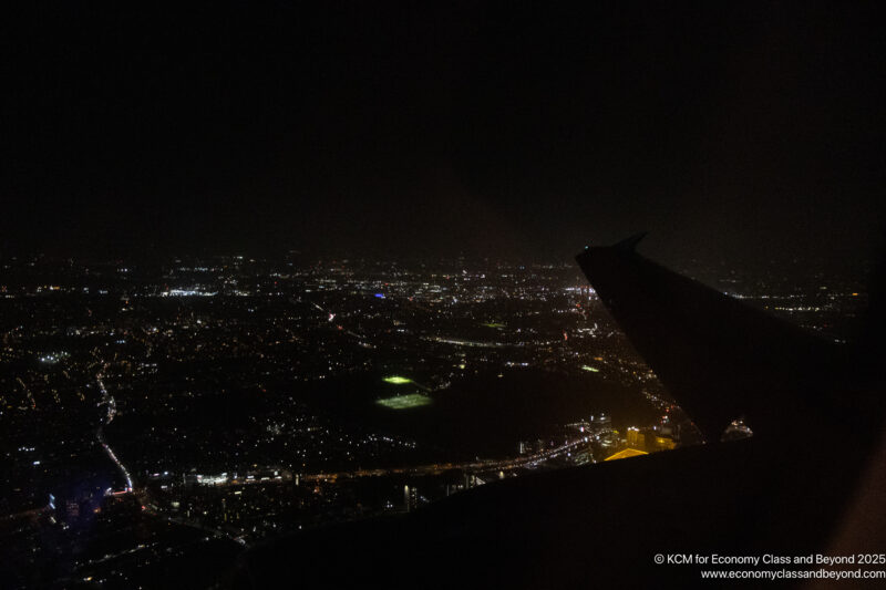 a view of a city at night from a plane