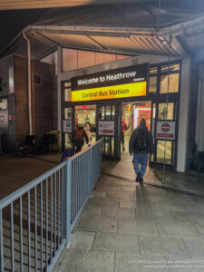 a man walking into a bus station