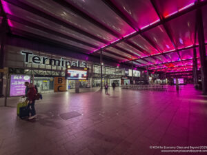 a large building with pink lights