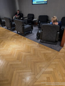 people sitting in chairs in a room