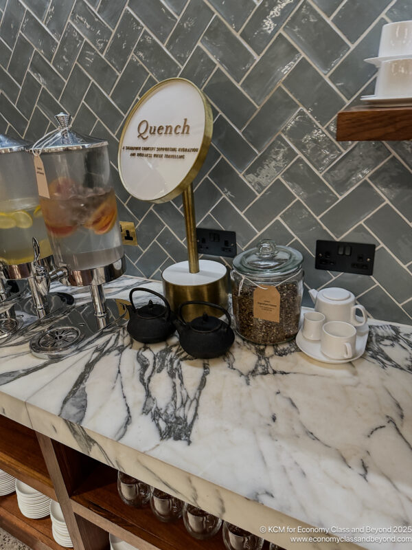 a counter with a variety of teas and teapots