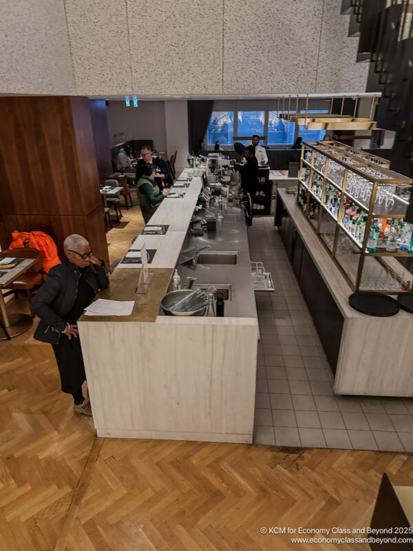 a group of people standing in a restaurant